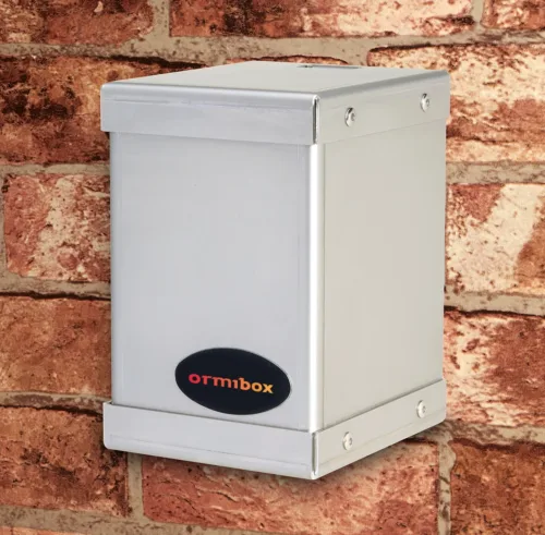 The Ormibox security tap box is installed on an outside wall.